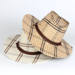 Detail of woven straw cowboy hats in beige and khaki showing texture and rope trim