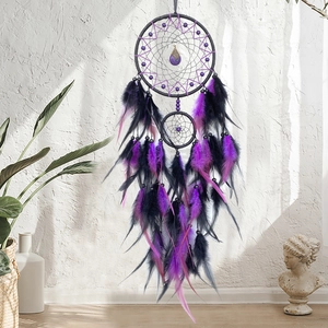 Handmade dreamcatcher wall hanging with black and purple feathers for home decoration