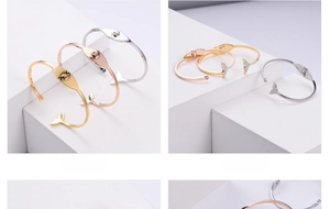Detailed view of elastic whale tail bracelets with sparkling pavé crystals in three colors