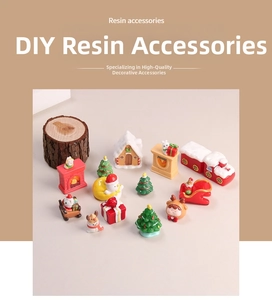 Detailed resin Christmas miniature set featuring a colorful train, snowman, and tree