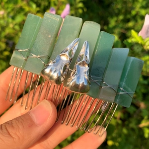Handmade green crystal hair comb with silver skull accents and metallic wire wrapping
