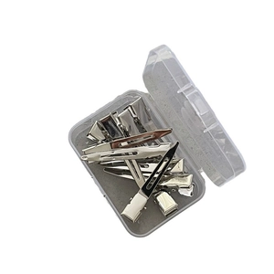 Set of silver metal duckbill hair clips organized in a clear plastic storage box