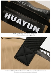 Detalle de las costuras en cruz reforzadas y la correa de marca HUAYUN en la bolsa