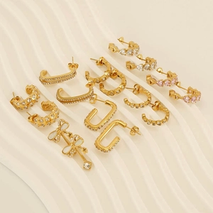 Detail shot of various 18k gold plated stainless steel hoop earrings with zircons