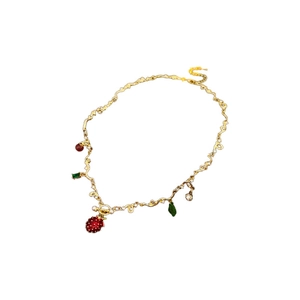 Dainty strawberry glass pendant necklace with gold chain and sparkling crystal accents