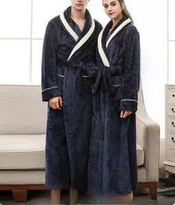 Detail of navy flannel bathrobe showing contrast piping and textured pineapple grid fabric