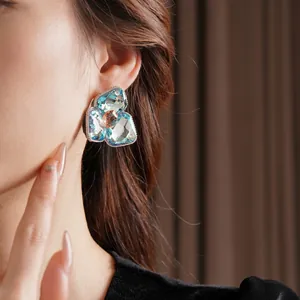 Elegant diamond-set diamond flower earrings with light blue and tea-colored crystals