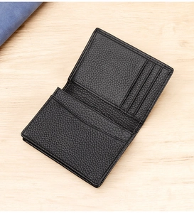 Detail view of the black lychee pattern leather card holder showing multiple interior slots