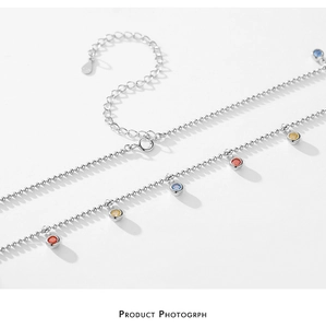 Detail of S925 sterling silver beaded chain with colorful bezel-set zircon stones