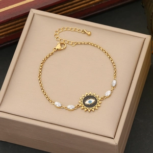 Gold stainless steel bracelet with evil eye sun pendant and marquise-cut zircons