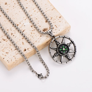 Retro stainless steel compass star pendant necklace on a decorative stone base
