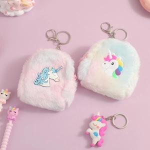 Detail of plush unicorn mini backpack pendants in pink and blue gradient faux fur