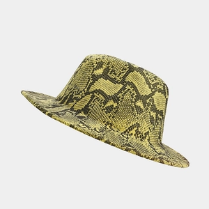 Detailed view of the yellow snakeskin pattern on the wide-brim wool fedora hat