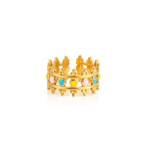 Detailed view of adjustable gold crown ring with pink, yellow and blue enamel dots