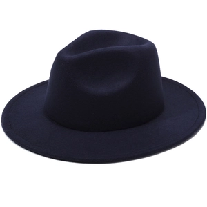 Detail of a navy blue wool felt fedora hat featuring a wide wavy brim and classic crown