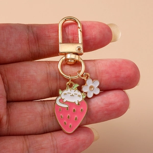 Cute Cartoon Cat On Strawberry Keychain Gold Zinc Alloy White Flower Pendant Enamel Animal Fruit Keyring For Women Bag Accessories Gift