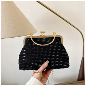 Handheld black rhinestone evening bag with elegant gold metal ring handle and chain