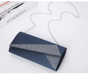 Detail of elegant navy blue evening clutch with silver rhinestone geometric patterns