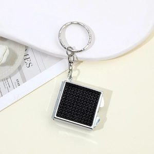 Two-in-one square keychain with a mini mirror and decorative black rhinestones