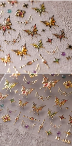 Macro detail of 5D gold butterfly nail stickers with metallic stars and moon reliefs