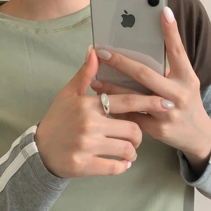 Macro shot of 925 silver octagonal star ring worn in a minimalist mirror selfie style