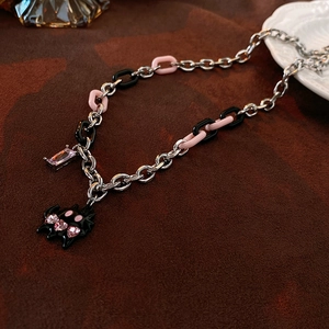Close-up of hip hop cat chain necklace with acrylic links and purple crystal pendant
