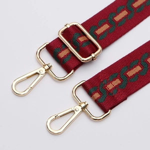 Adjustable red and green shoulder strap with gold metal buckles for crossbody bags