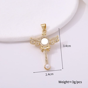Golden wing pendant detail with cubic zirconia and pearl, 3.4cm size macro view