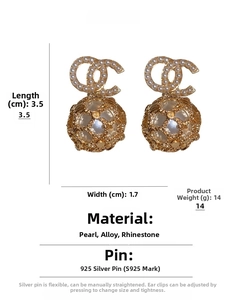 Detailed view of vintage pearl drop earrings with hollow gold filigree and S925 silver pins