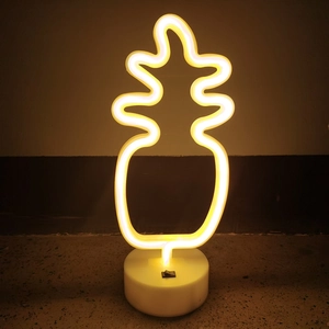 Pineapple LED neon desk lamp with white base for festive bedroom atmosphere
