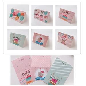Variety set of colorful birthday cards with balloons and cake designs on a white backdrop