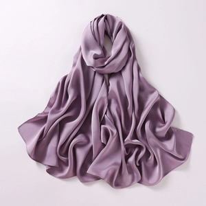 Detailed close-up of folded purple chiffon scarf showing smooth silk texture and sheen