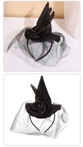 Detail of gothic witch hat headband with black roses, delicate feathers and mesh veil