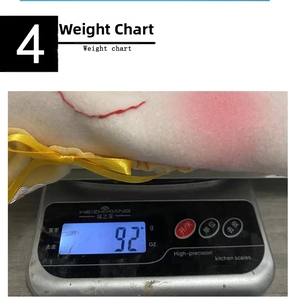Macro detail of plush pink Christmas stocking showing weight measurement at 92g on scale