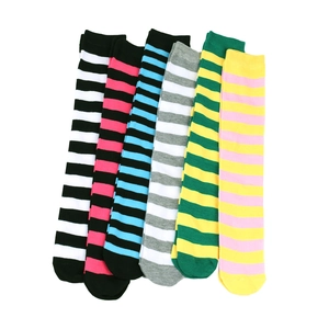 Detailed flat lay of assorted colorful striped over-the-knee cotton socks in six vibrant patterns