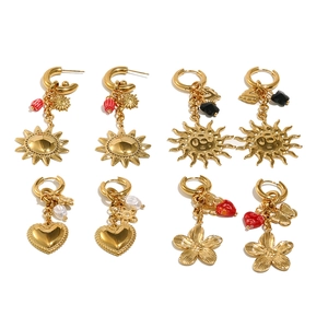 Set of four gold stainless steel dangle earrings with sun, heart and floral charms