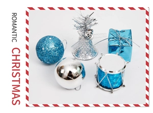 Close-up of blue and silver Christmas ornaments set including glitter balls and bells