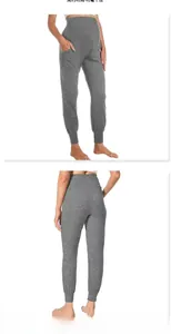 Macro detail of high-waisted dark grey maternity joggers with supportive belly panel