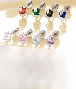 Macro shot of colorful heart zircon snake studs showing 0.8x6mm titanium steel posts