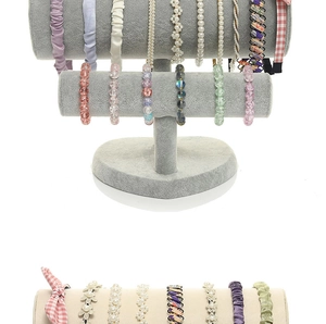 Detail view of colorful velvet headbands and beaded bracelets on tiered display stands