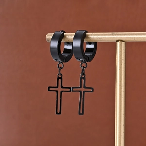 Punk style matte black stainless steel cross earrings for men and women on gold display stand