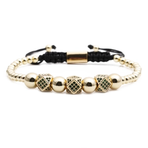 Bracciale a sfere dorate regolabile con cubi in zircone verde e cordino nero