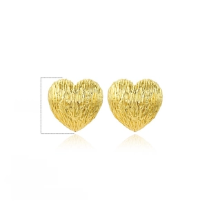 Detail showing 18mm gold heart stud earrings with irregular brushed copper texture