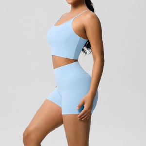 Sky blue two-piece yoga set featuring thin strap sports bra and high waist shorts