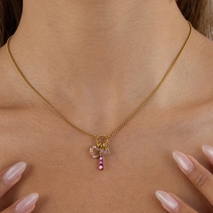 Gold stainless steel necklace with pink zircon hollow heart and vertical bar pendant