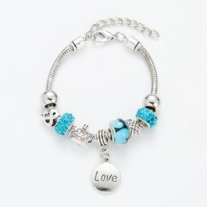 Detailed close-up of silver beaded bracelet with blue crystals and I Love You pendant