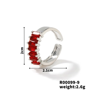Detail view of silver open ring featuring a row of red rectangular zircon stones