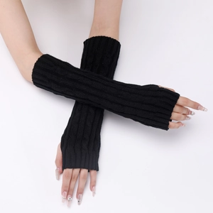Detail of black knit fingerless long gloves with ribbed texture and thumb hole