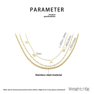 Close-up of golden stainless steel triple layer necklace with MAMA pendant and twist chain