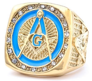 Macro shot of gold Masonic ring with blue enamel, square and compass symbol, and zircons